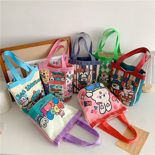 Cute graffiti bucket bag ins print cylinder bag canvas bento bag Korean style girl hand carrying lunch box mommy bag