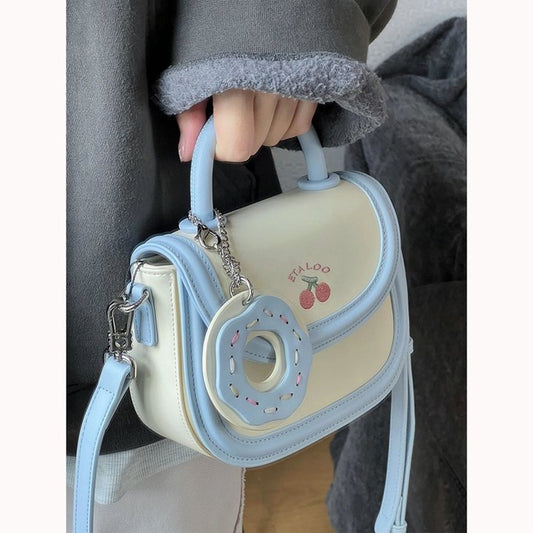 2023 new bag cute junior high school student saddle bag Japanese biscuit off-white hand-held single shoulder Messenger bag female spring